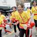 A drummer with the Annuha Chinese School reacts to a friend in the crowd as she marches during the 23rd Annual Ann Arbor Jaycees Fourth of July Parade on Thursday, July 4, 2013 on South State Street in downtown Ann Arbor. Melanie Maxwell | AnnArbor.com